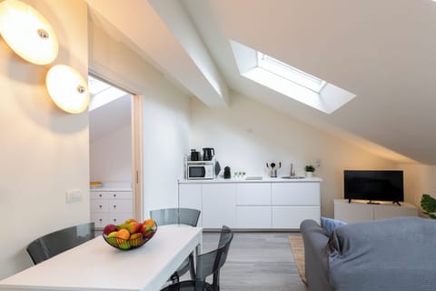 Deluxe Condo | Living area | 40-inch Smart TV with digital channels