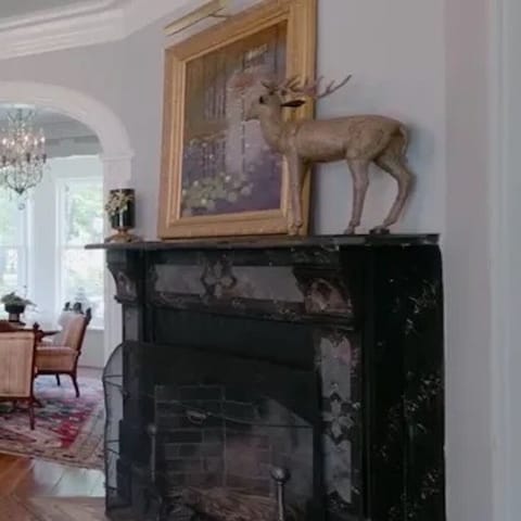 An original Victorian fireplace, one of the seven fireplaces on the property.  