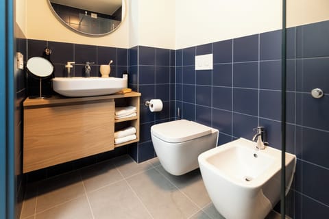 Shower, towels, soap, toilet paper