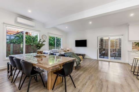 Open plan dining, living and kitchen area.