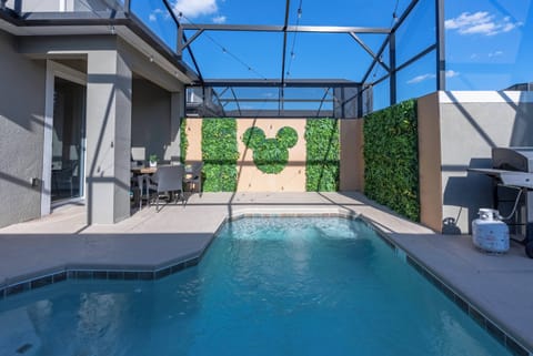 Step outside to your private oasis with a sparkling pool, lush greenery, and a spacious screened area for comfort. Relax under the sun or enjoy leisurely moments in the ample seating just steps away.