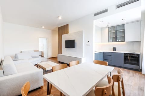 Deluxe Apartment | Living area | 40-inch LED TV with digital channels