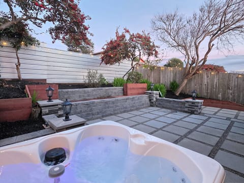 Relax and unwind with a glass of wine in the new hot tub.