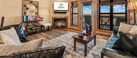 Spacious Living Area with Deck Access, Cable TV, Seasonal Fireplace, and Games.