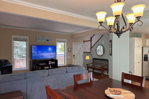 Streaming is a breeze w/ Starlink internet! Make yourself at home on this large sectional sleeper sofa and open concept living and dining room.