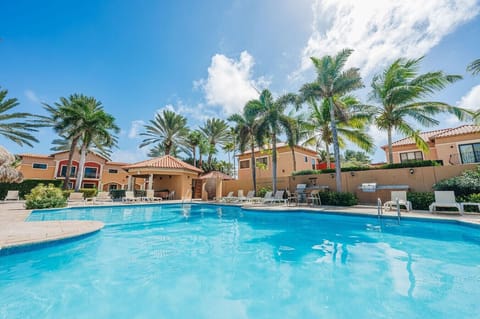 One of three Gold Coast swimming pools, relax in one of the many lounging places, enjoy a shared BBQ grill and find cooling shade in the palapas