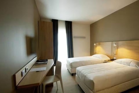 Down comforters, memory foam beds, in-room safe, desk