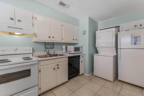 Kitchen with washer and dryer