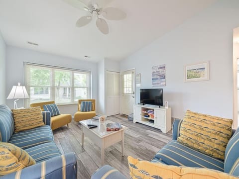 Bright and inviting room with cozy seating and stylish coastal decor.