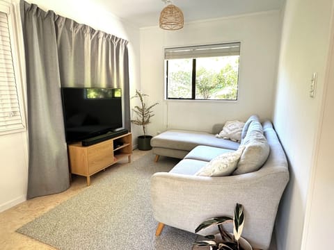 Comfortable lounge area with Apple TV and soundbar