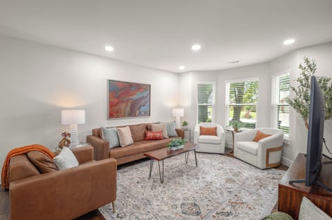 Relax and unwind in a comfortable living room designed for rest, connection, and easy downtime.