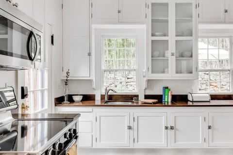 Kitchen: Bright and airy with modern appliances and charming views—perfect for culinary adventures!