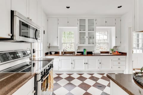 Fully Stocked Kitchen: Bright kitchen with stylish decor and modern appliances, perfect for culinary adventures!