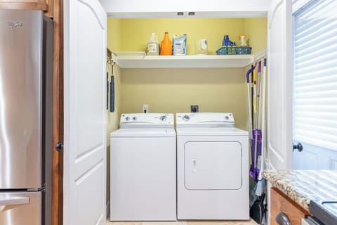 Laundry Closet - A spacious laundry closet features a full size washer and dryer for use during your stay.