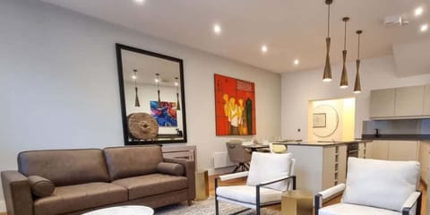 Bright, spacious open-plan living and dining area where guests say it feels even better in person than the photos