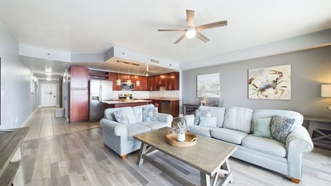 Open concept living area with TV coastal views and sleeper sofa