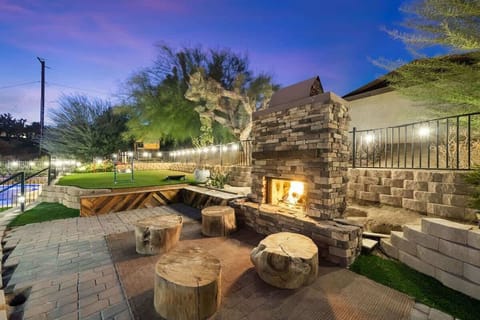 Enjoy a cold beverage while relaxing near a wood burning fire place