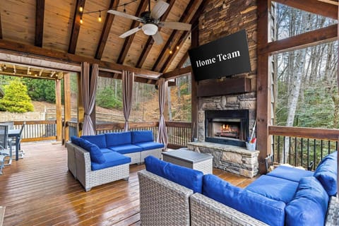  Sink into plush seating, cozy up by the fireplace, and enjoy your favorite show—all on the outdoor patio with breathtaking views!