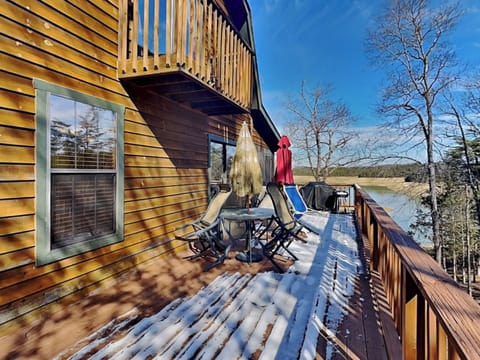 Deck Off the Kitchen Area With Seating and a Scenic View of Douglas Lake
