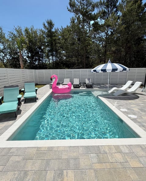 Our new 10’ x 22’ pool with tanning /splash shelf and new pool furniture!