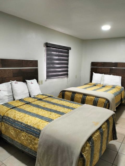 Economy Triple Room, Patio, City View | Laptop workspace, free WiFi