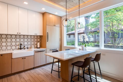 Modern kitchen featuring a sleek Wolf fridge, perfect for culinary enthusiasts.