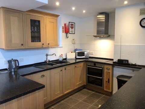 Kitchen, Countertop, Kitchen Appliance, Major Appliance, Cabinetry, Wood, Interior Design, Flooring, Kitchen Stove, Stove