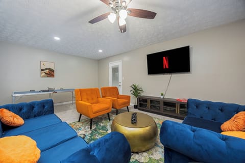 Open Living Room with 65" Smart TV for entertaining
