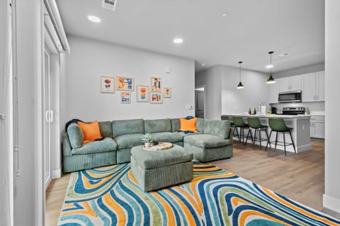 Step into the inviting open-concept living space, flooded with natural light. The contemporary decor and plush sectional is perfect for relaxing after a day of exploring. Need extra space for sleeping this couch is perfect and can easily sleep 2.