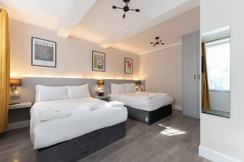 Classic Quadruple Room | In-room safe, desk, blackout drapes, iron/ironing board