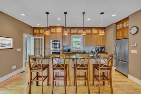 Gather around the kitchen bar for a relaxed meal with a view of the chef at work.