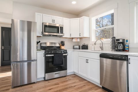 Fully equipped kitchen with forest views and modern amenities
