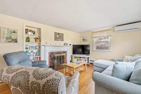  A cozy sectional, reclining chair, and stylish armchair ensure there’s plenty of space for everyone to kick back after a day at the beach.