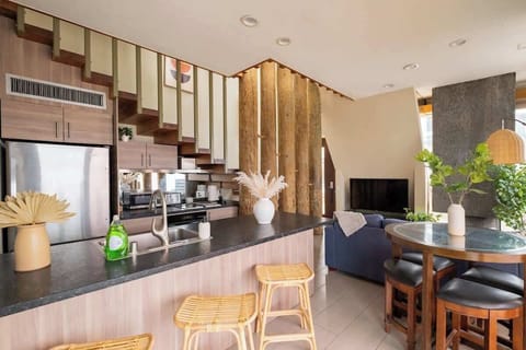 Sit up at the breakfast bar and keep the chef company as they cook