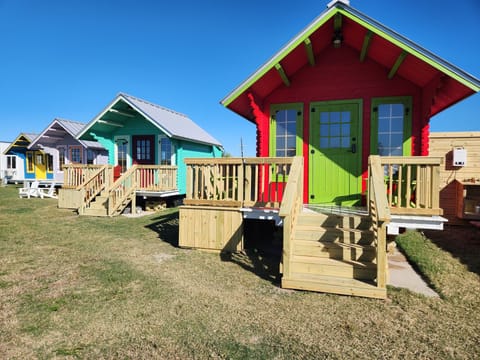 Welcome to BOLI Bunkies! Here you will book one of these eight tiny homes! Meet "Watermelon" here!