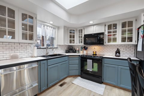 Corner coffee maker, tea, spices, utensils, storage bags, and kids' dining set.