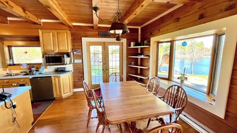The door opens to the large wrap-around deck with outdoor dinning options