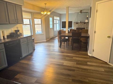 A full picture of kitchen, family room and breakfast area.