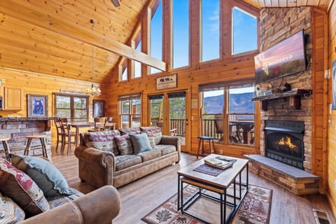 Signature Cabin, 4 Bedrooms, Balcony, Mountain View | Living room | 55-inch Smart TV with digital channels, fireplace, foosball