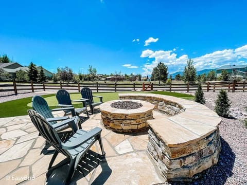 Enjoy mountain views and an incredible outdoor retreat with a saltwater hot tub, putting green, and firepit.