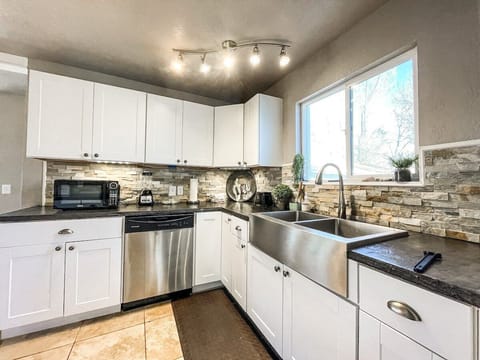 The kitchen is stocked with everything needed for both short- and long-term stays, making meals at home easy and enjoyable.