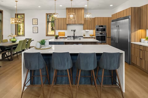 Sleek, Modern, and Equipped with High-End Appliances and Double Islands