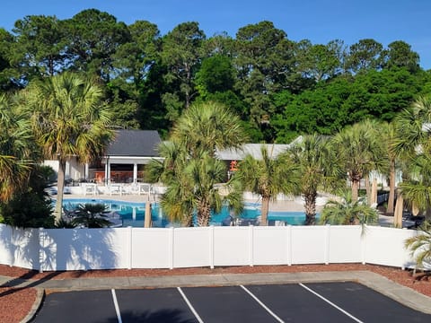 Sunset Tiki bar and pool behind condo 