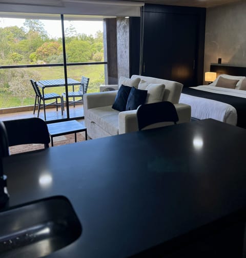 Exclusive Suite, Garden View | Living area | Smart TV