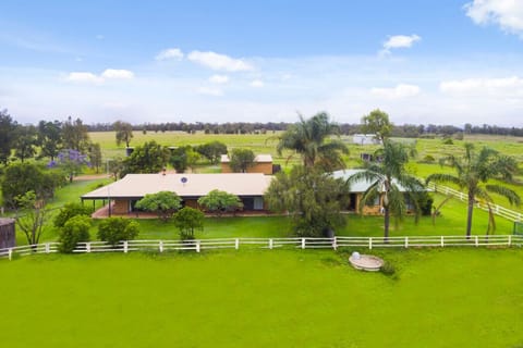 The main home and Cottage is set on 31 acres and surrounded by country land.