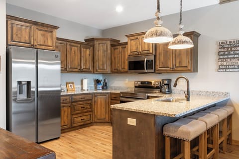 Full Kitchen with Upgraded Appliances and Extra Bar Seating