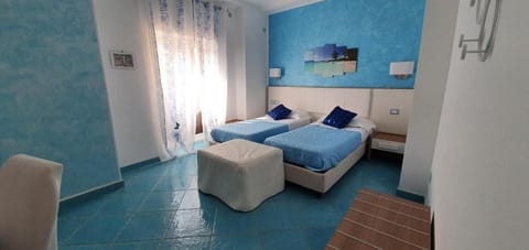 Basic Triple Room, Balcony, Mountain View | In-room safe, desk, blackout drapes, iron/ironing board