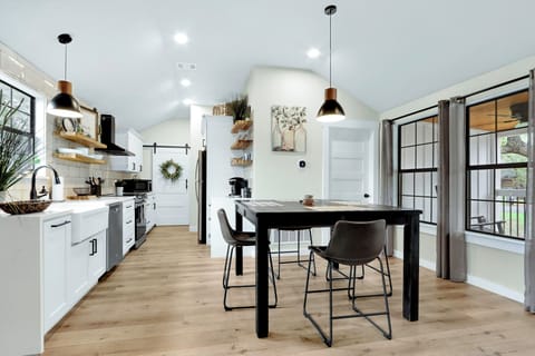 Dining room table with the kitchen off to the left.
