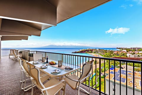 Expansive wraparound oceanfront balcony showcasing breathtaking views from every angle. Where the horizon stretches endlessly across Maui’s coastline.