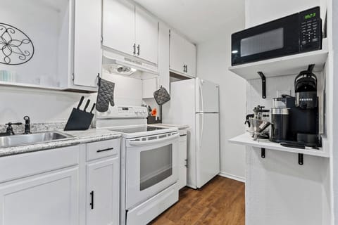 The kitchen has a dedicated area for coffee (Keurig machine!), microwave, and blender (not pictured) in the kitchen.